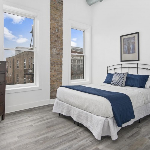 Generous bedroom offerings to fit every family spacious bedroom with a bed and windows