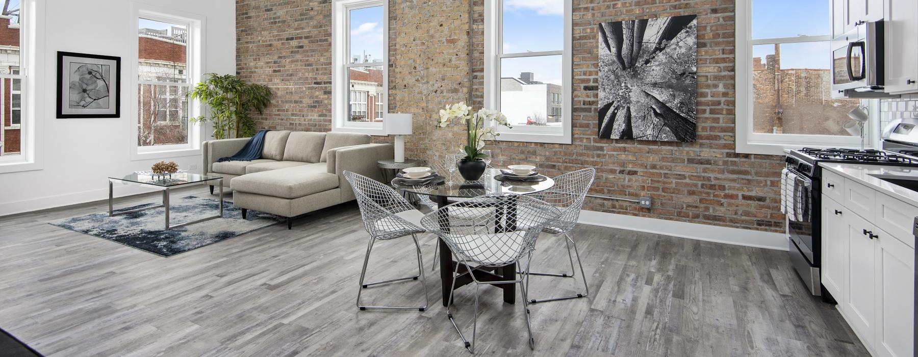 windows with city views in living areas with brick wall