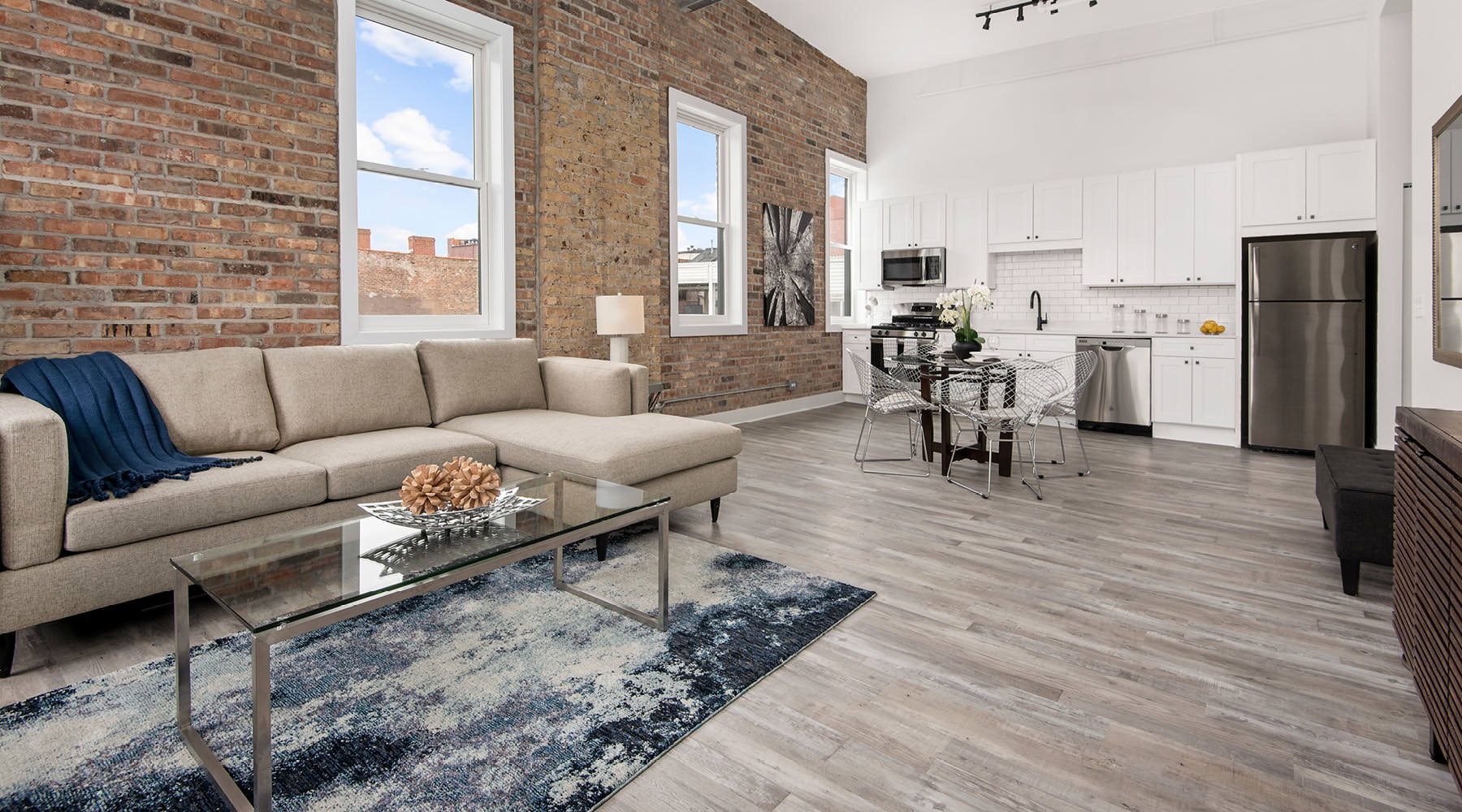 The Art of Living spacious living room open to kitchen
